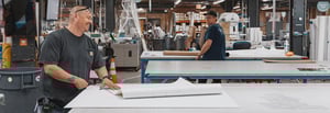 Cushing's production team working in the print shop
