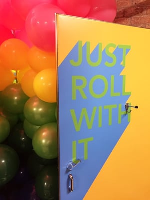 Close Up of Just Roll With It Interior Washroom Stall Graphics