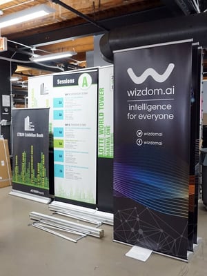 Banner-Stands-Lined-up-In-Graphics-Lab