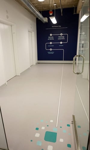 GRAPHICS GREET VISITORS AS THEY STEP OFF THE ELEVATOR