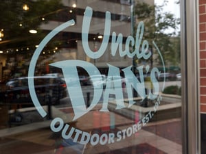 CLOSE UP OF WINDOW DECAL AT UNCLE DAN'S STOREFRONT