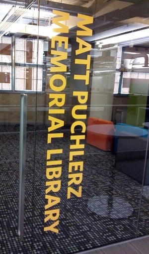 A glass door with matt pugh memorial written on it