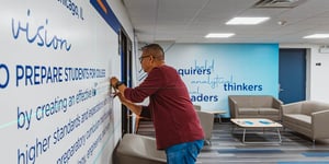 Luis Installing Wall Graphic