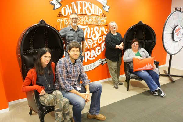 Discovery USA Team Photo With Their Wall Graphics Installation Discovery USA Team Photo With Their Wall Graphics Installation